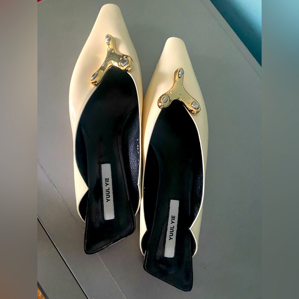 Cream coloured designers flats